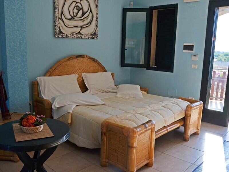 Double room with bamboo furniture at B&b Fa.ro.mi